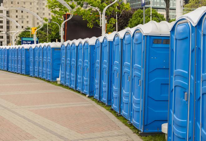 a row of portable restrooms at a fairground, offering visitors a clean and hassle-free experience in tega